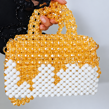 Close view of the Champagne Bloom Bag held by its handle