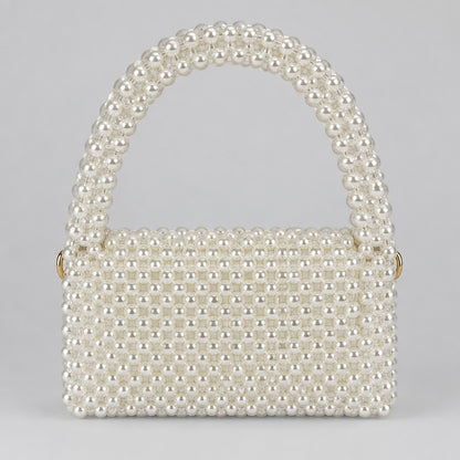 Pearl Muse Bag, structured white pearl bag with a beaded handle, front view